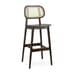 Angled front view of bar stool with natural cane backrest, walnut finish frame, and veneered wooden seat