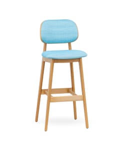 Front corner view of commercial bar stool in natural finish with blue upholstery fabric seat and back